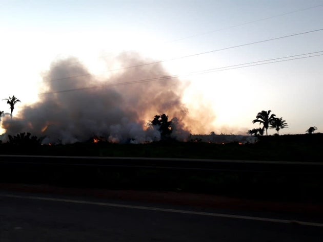 Fires burned on the side of the road in Altamira on Sunday at dusk.