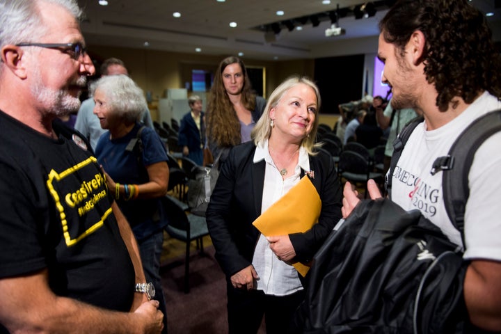 Rep. Susan Wild talks with constituents following a town hall meeting at Muhlenberg College in Allentown, Pennsylvania. The c