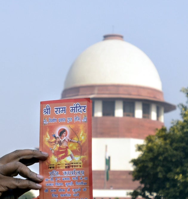 A member of a Hindu group holds a placard during a protest to demand the construction of the Ram Temple, near the Supreme Court on January 10, 2019 in New Delhi, India.