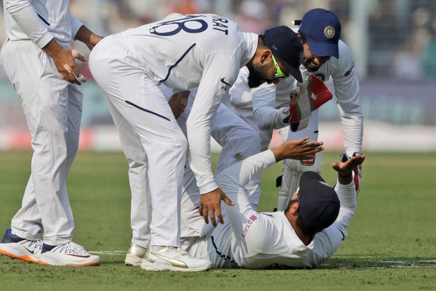 Captain Virat Kohli congratulates Rohit Sharma for taking a catch to dismiss Bangladesh's Mominul Haque.