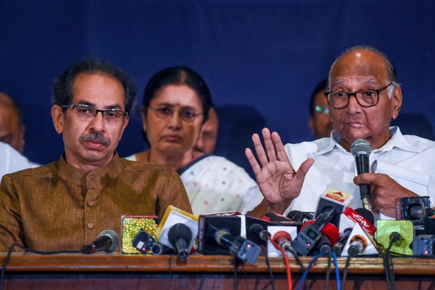 Shiv Sena party Chief Uddhav Thackeray (L) looks on as Nationalist Congress Party (NCP) Chief Sharad Pawar speaks at a press conference in Mumbai on November 23, 2019. - Indian Prime Minister Narendra Modi's party made an unexpected comeback to power on November 23 in wealthy Maharashtra state, home to the country's financial capital, after prolonged backroom negotiations saw presidential rule lifted after days of uncertainty. (Photo by Indranil MUKHERJEE / AFP) (Photo by INDRANIL MUKHERJEE/AFP via Getty Images)