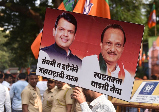 BJP workers celebrate outside BJP office at Nariman Point, on November 23, 2019 after BJP's Devendra Fadnavis took oath as the Maharashtra Chief Minister on Saturday along with NCP leader Ajit Pawar as the deputy chief minister.