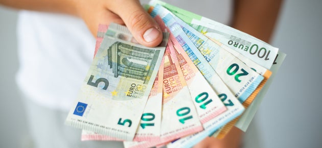 Man hands holding euro banknotes. Selective focus