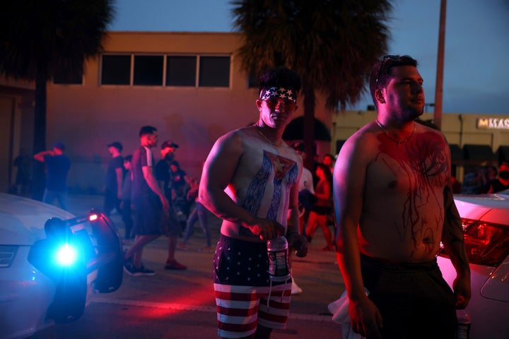 Biden Stands By Protesting Cubans, Demands Regime 'Hear Their People' 2 Two people with the Cuban flag painted on themselves demonstrate in the street near Versailles, a Cuban restaurant in Miami's