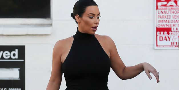 Pregnant Kim Kardashian Steps Out In A Little Black Dress