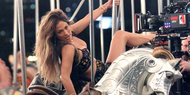 Jennifer Lopez Sizzles On Set Of New Music Video With Racy Ride On Merry-Go-Round