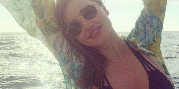 Miranda Kerr Gets Cheeky In A Bikini On The Beach