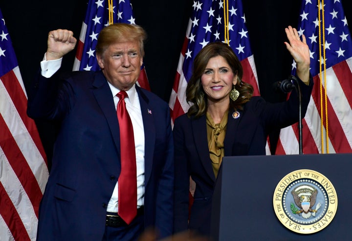 FILE – President Donald Trump appears with South Dakota Gov. Kristi Noem in 2018. Aides caution it is far too early for serious discussions about a running mate. But Trump has indicated in conversations that he is interested in selecting a woman this time around.