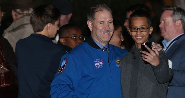 <span class='image-component__caption' itemprop="caption">Ahmed Mohamed poses with former astronaut and NASA Associate Administrator for the Science Mission Directorate John Grunsfeld.</span>