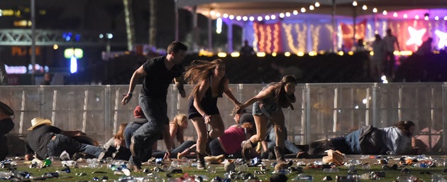 People flee from the Route 91 Harvest country music festival after gunfire was heard.