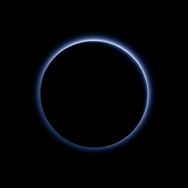 <span class='image-component__caption' itemprop="caption">Pluto's haze layer looks blue in this picture taken by the New Horizons spacecraft. The high-altitude haze is thought to be similar to that seen at Saturn's moon Titan. The source of both hazes likely involves sunlight-initiated chemical reactions of nitrogen and methane, leading to soot-like particles (tholins) that grow as they settle toward the surface. This image was generated by software that combines information from blue, red and near-infrared images to replicate the color a human eye would perceive as closely as possible.</span>