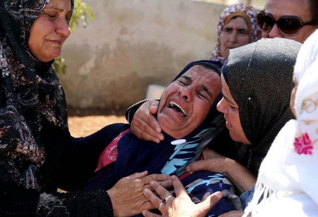 <span class='image-component__caption' itemprop="caption">Relatives mourn during the Aug. 8, 2015, funeral of Saad Dawabsheh, the father of a Palestinian toddler burned to death in an arson attack by Jewish extremists in the West Bank, in the Duma village of the city of Nablus.</span>