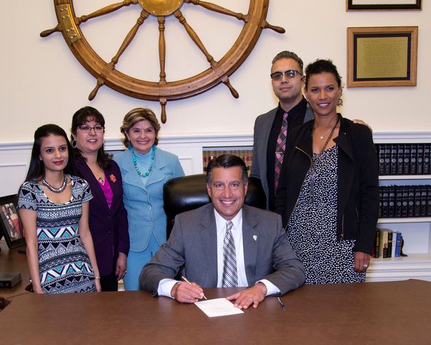 Gloria Allred, Lise-Lotte Lublin and Benjamin Lublin join Nevada Governor Brian Sandoval as he signs AB212 into law.