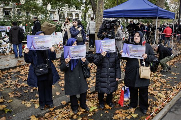 <span class='image-component__caption' itemprop="caption">Muslim women hold placards against fundamentalism during the commemoration for victims of Paris terror attacks in front of Bataclan, Boulevard Voltaire in Paris, France on November 17, 2015.</span>
