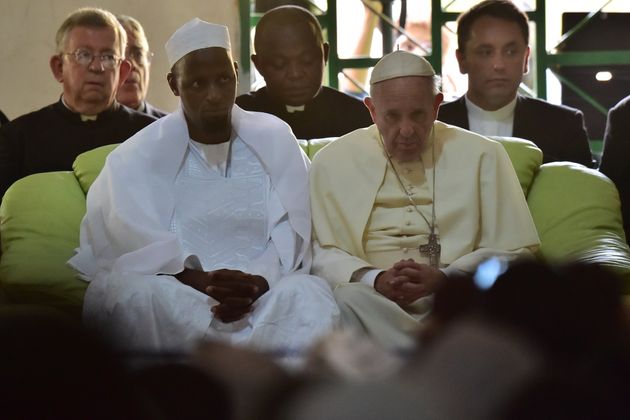 <span class='image-component__caption' itemprop="caption">Pope Francis (C) looks on, alongside Imam Nehedid Tidjani (2-L), during a visit to the Central Mosque in Bangui on November 30, 2015. Pope Francis said on November 30 that Christians and Muslims were 'brothers', urging them to reject hatred and violence while visiting a mosque in the Central African Republic's capital which has been ravaged by sectarian conflict. </span>
