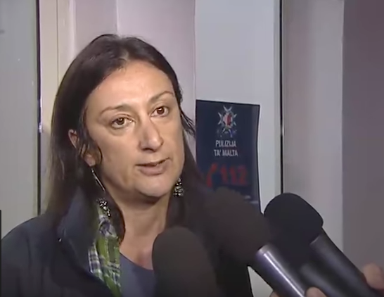 Caruana Galizia addresses the media in 2013 following her arrest over an article she published on her blog