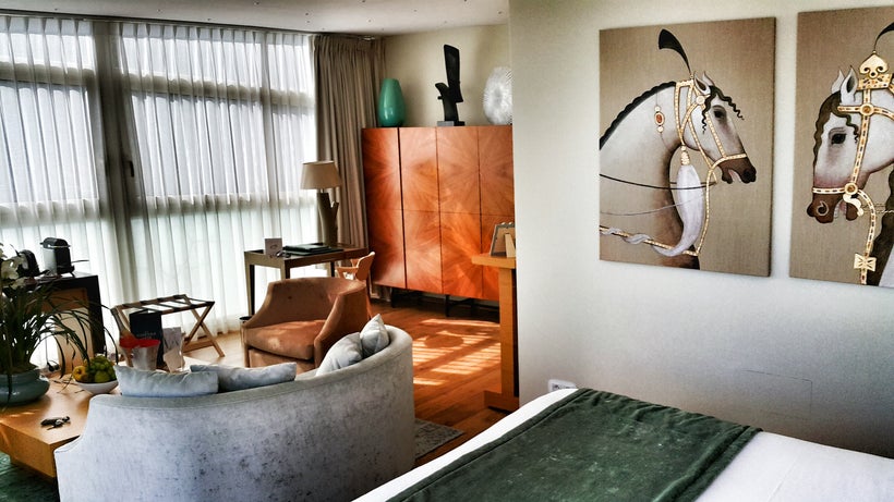 Crepe curtains, sofa, beautiful office desk +1 point, entertainment center and the framed photos were as exquisitely French with a hint of Swiss design