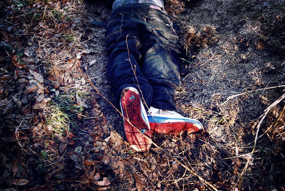 <span class='image-component__caption' itemprop="caption">Robert Chambers' body lies on the ground after he was shot and killed by a police officer.</span>