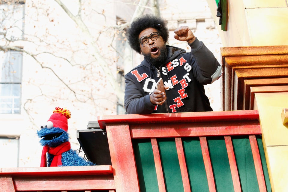 <span class='image-component__caption' itemprop="caption">Drummer Questlove jams out on his float with Cookie Monster. </span>