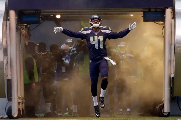 Marshawn Lynch of the Seattle Seahawks eats Skittles as he addresses  News Photo - Getty Images