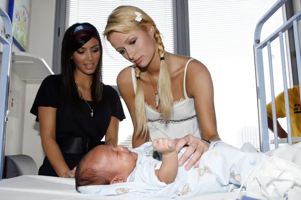 Kim Kardashian and her old boss Paris Hilton serve early 2000s