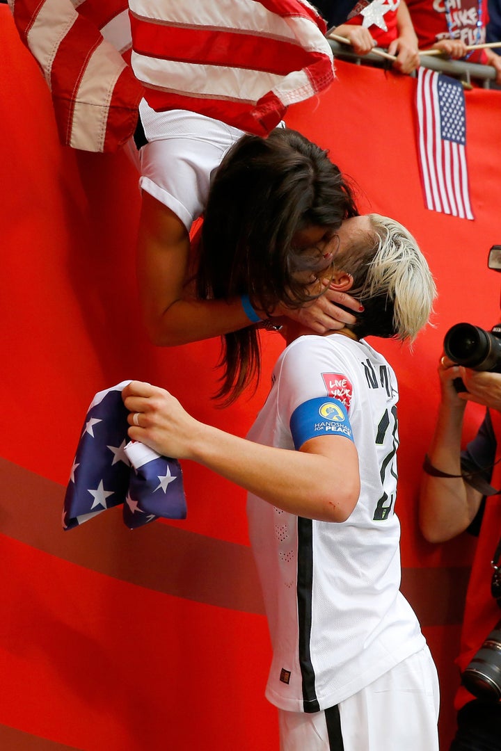 U.S. soccer player Abby Wambach celebrates with wife Sarah Huffman after the U.S. team's 5-2 victory against Japan in the FIFA Women's World Cup on July 5, 2015, in Vancouver, Canada. 