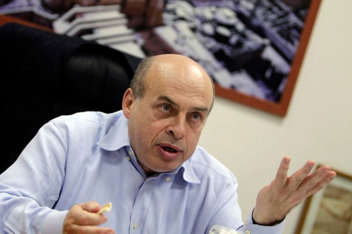 Jewish Agency chairman and ex-Soviet dissident Natan Sharansky gestures as he speaks during an interview in Jerusalem on February 9, 2011.