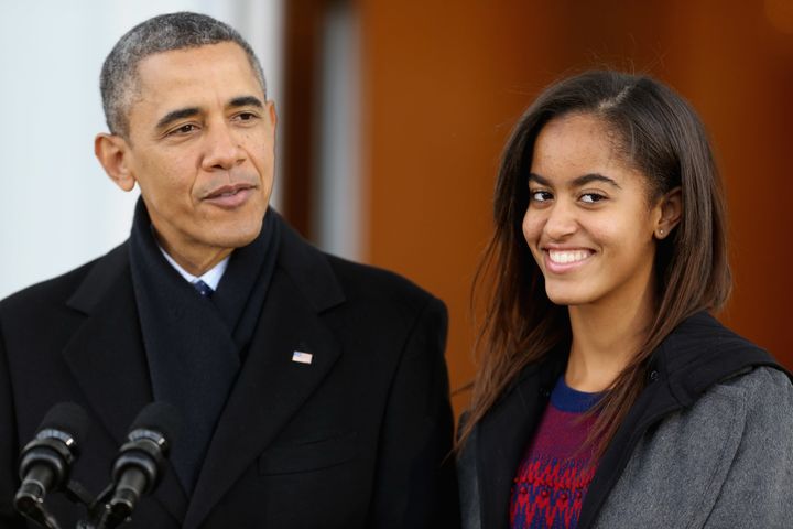 WASHINGTON, DC - NOVEMBER 27: U.S. President Barack Obama delivers remarks with his daughter Malia Obama, 15, before pardoning the 2013 National Thanksgiving Turkey, 'Popcorn' on the North Portico of the White House November 27, 2013 in Washington, DC. A 38-pound, full-grown Broad Breasted White domesticated turkey, 'Popcorn' and its alternate 'Caramel' will be sent to live at Mount Vernon, the estate and home of George Washington. (Photo by Chip Somodevilla/Getty Images)