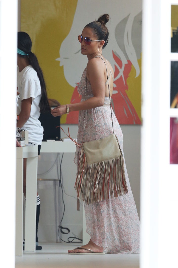<p><em>Jennifer Lopez goes shopping in the Hamptons wearing a flowy summer dress.</em></p>