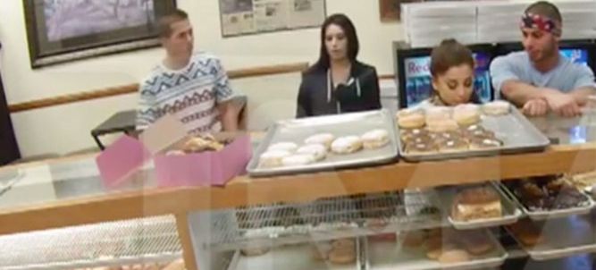 Ariana Grande licks doughnuts she hasn't purchased.