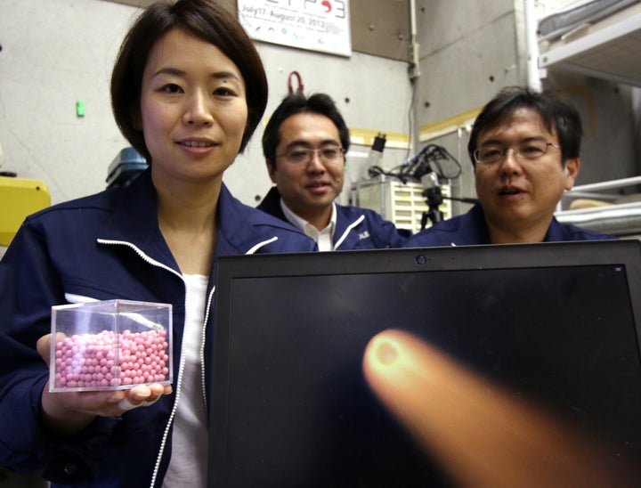 Lena Okajima of space startup ALE shows the pellets she says can be used to create artificial meteor showers. 