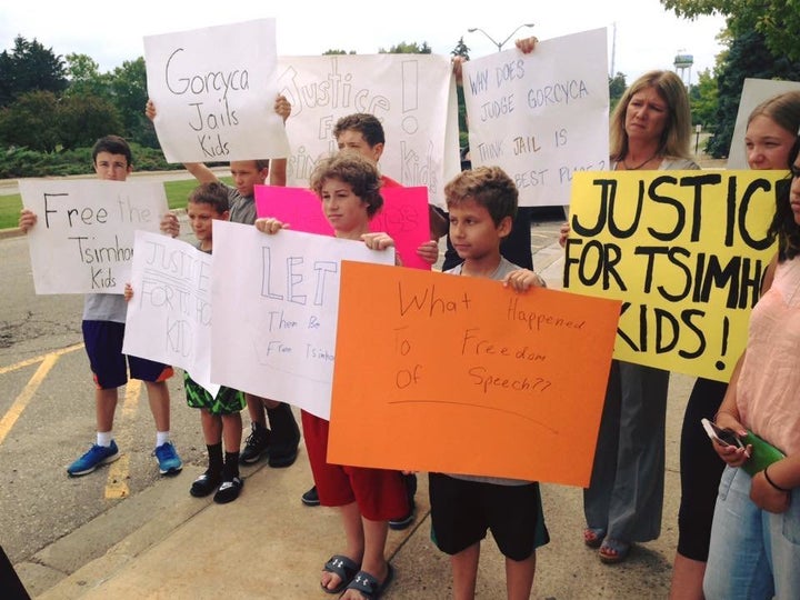 Parents and children protest for the release of three Michigan children who were sent to a juvenile detention center for refusing to communicate with their father, Wednesday July 8, 2015. Oakland County Circuit Judge Lisa Gorcyca lifted the contempt of court charge and ordered they be released and sent to summer camp Friday. 