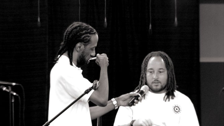 The Rev. Tony Lee (left) is tested for HIV during a worship service at Community of Hope Church in Maryland.