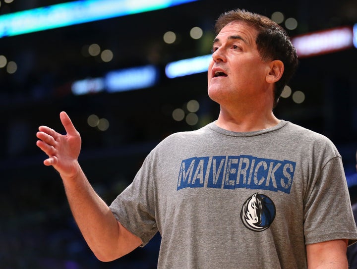 Dallas Mavericks owner Mark Cuban talks to a referee during a timeout in the game with the Los Angeles Lakers at Staples Cent