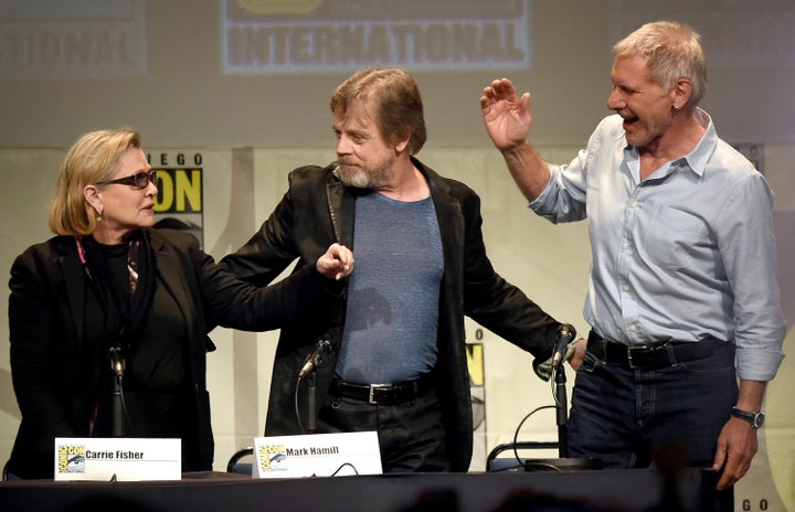 SAN DIEGO, CA - JULY 10: (L-R) Actors Carrie Fisher, Mark Hamill and Harrison Ford pose onstage at the Lucasfilm panel during Comic-Con International 2015 at the San Diego Convention Center on July 10, 2015 in San Diego, California. (Photo by Kevin Winter/Getty Images)