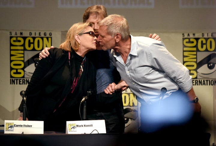 SAN DIEGO, CA - JULY 10: (L-R) Actors Carrie Fisher, Mark Hamill and Harrison Ford pose onstage at the Lucasfilm panel during Comic-Con International 2015 at the San Diego Convention Center on July 10, 2015 in San Diego, California. (Photo by Kevin Winter/Getty Images)