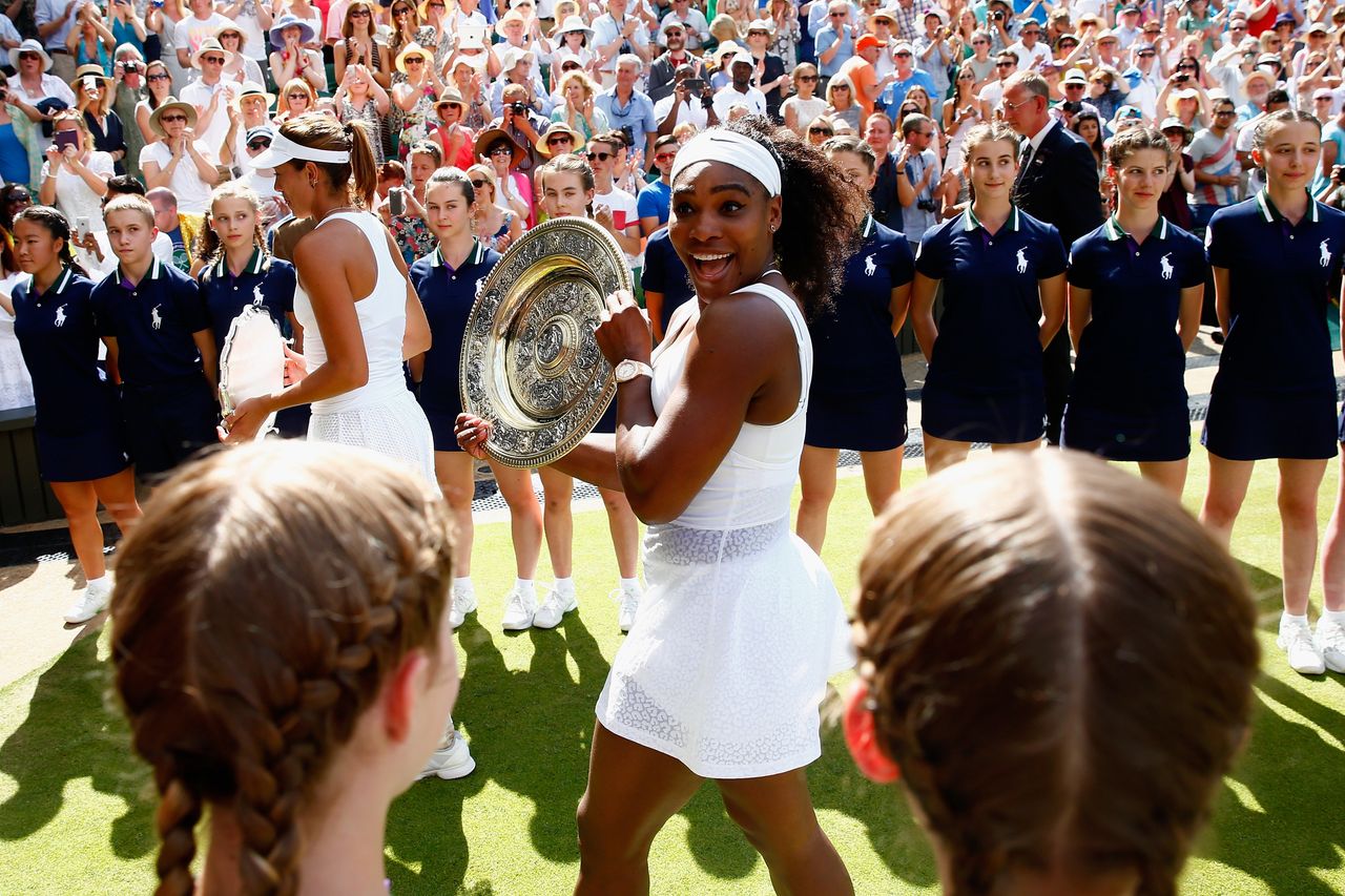 LONDON, ENGLAND - JULY 11: Serena Williams of the United States leaves court with the Venus Rosewater Dish after her victory in the Final Of The Ladies' Singles against Garbine Muguruza of Spain during day twelve of the Wimbledon Lawn Tennis Championships at the All England Lawn Tennis and Croquet Club on July 11, 2015 in London, England. (Photo by Julian Finney/Getty Images)