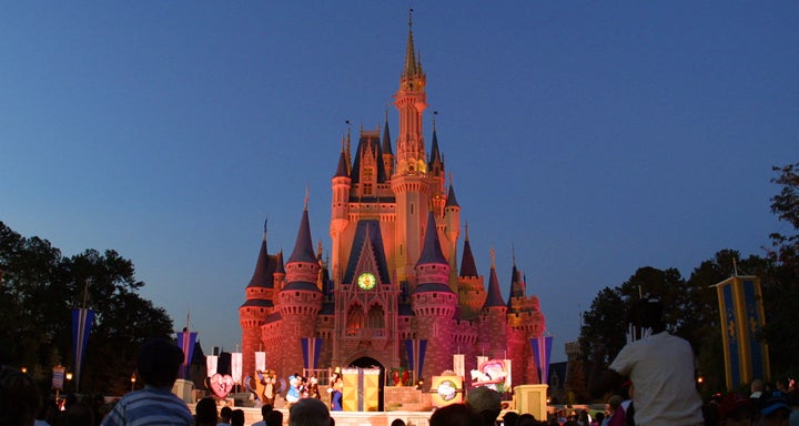 ORLANDO, FL - NOVEMBER 11: (FILE PHOTO) People watch a show on stage in front of Cinderella's castle at Walt Disney World's Magic Kingdom November 11, 2001 in Orlando, Florida. Health officials said a salmonella outbreak at Walt Disney World sickened as many as 141 people, including visitors attending an athletic competition for organ-transplant recipients August 23. (Photo by Joe Raedle/Getty Images)