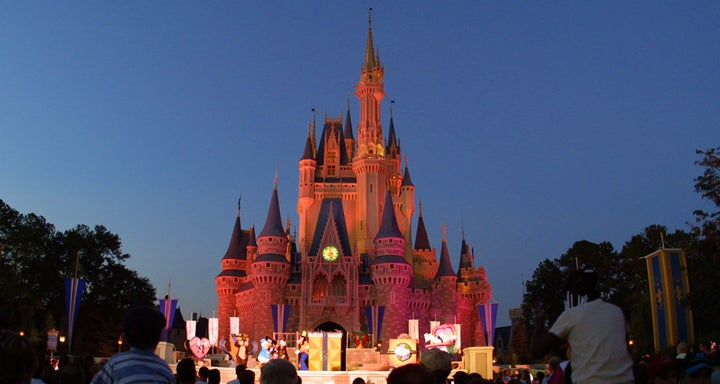 ORLANDO, FL - NOVEMBER 11: (FILE PHOTO) People watch a show on stage in front of Cinderella's castle at Walt Disney World's Magic Kingdom November 11, 2001 in Orlando, Florida. Health officials said a salmonella outbreak at Walt Disney World sickened as many as 141 people, including visitors attending an athletic competition for organ-transplant recipients August 23. (Photo by Joe Raedle/Getty Images) 