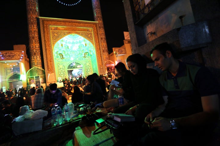 Iranian Shiite Muslims pray in Tehran in the early hours of July 7, 2015 in commemoration of the death of the seventh century Imam Ali bin Abi Taleb and in preparation for Laylat al-Qadr -- a high point during Ramadan when the Koran holy book was revealed to the Prophet Mohammed. Imam Ali, the first male convert to Islam, is the fourth caliph to succeed Prophet Mohammed, his cousin and father-in-law. AFP PHOTO/ATTA KENARE (Photo credit should read ATTA KENARE/AFP/Getty Images)