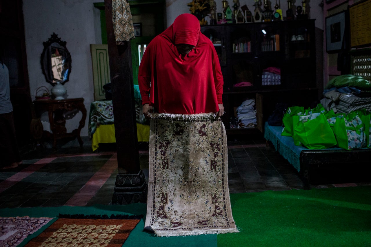 YOGYAKARTA, INDONESIA - JULY 12: A member of a Pesantren boarding school, Al-Fatah, for transgender people known as 'waria' prepares for pray during Ramadan on July 12, 2015 in Yogyakarta, Indonesia. During the holy month of Ramadan the 'waria' community gather to break the fast and pray together. 'Waria' is a term derived from the words 'wanita' (woman) and 'pria' (man). The Koran school Al-Fatah was set back last year's by Shinta Ratri at her house as a place for waria to pray, after their first founder Maryani died. The school operates every Sunday. Islam strictly segregates men from women when praying, leaving no-where for 'the third sex' waria to pray before now. (Photo by Ulet Ifansasti/Getty Images)