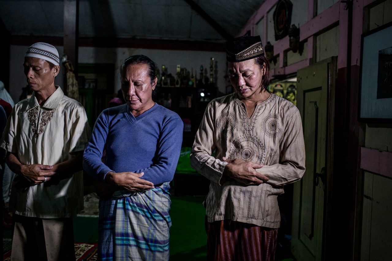 YOGYAKARTA, INDONESIA - JULY 12: Members of a Pesantren boarding school, Al-Fatah, for transgender people known as 'waria' pray during Ramadan on July 12, 2015 in Yogyakarta, Indonesia. During the holy month of Ramadan the 'waria' community gather to break the fast and pray together. 'Waria' is a term derived from the words 'wanita' (woman) and 'pria' (man). The Koran school Al-Fatah was set back last year's by Shinta Ratri at her house as a place for waria to pray, after their first founder Maryani died. The school operates every Sunday. Islam strictly segregates men from women when praying, leaving no-where for 'the third sex' waria to pray before now. (Photo by Ulet Ifansasti/Getty Images)