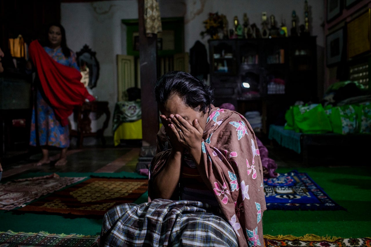 YOGYAKARTA, INDONESIA - JULY 12: Inez, a member of a Pesantren boarding school, Al-Fatah, for transgender people known as 'waria' pray during Ramadan on July 12, 2015 in Yogyakarta, Indonesia. During the holy month of Ramadan the 'waria' community gather to break the fast and pray together. 'Waria' is a term derived from the words 'wanita' (woman) and 'pria' (man). The Koran school Al-Fatah was set back last year's by Shinta Ratri at her house as a place for waria to pray, after their first founder Maryani died. The school operates every Sunday. Islam strictly segregates men from women when praying, leaving no-where for 'the third sex' waria to pray before now. (Photo by Ulet Ifansasti/Getty Images)