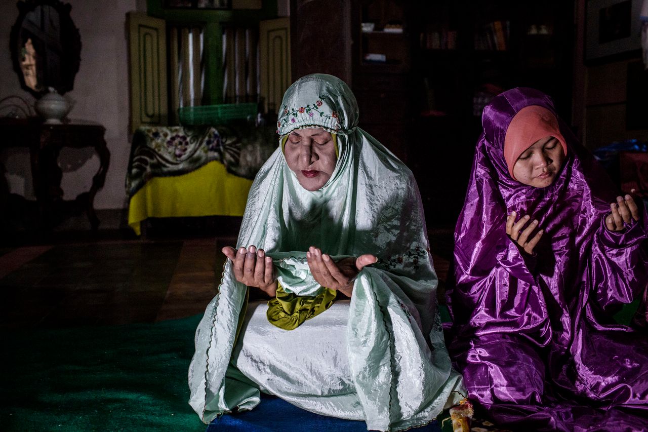 YOGYAKARTA, INDONESIA - JULY 08: Shinta Ratri, a leader of a Pesantren boarding school, Al-Fatah, for transgender people known as 'waria' prays during Ramadan on July 08, 2015 in Yogyakarta, Indonesia. During the holy month of Ramadan the 'waria' community gather to break the fast and pray together. 'Waria' is a term derived from the words 'wanita' (woman) and 'pria' (man). The Koran school Al-Fatah was set back last year's by Shinta Ratri at her house as a place for waria to pray, after their first founder Maryani died. The school operates every Sunday. Islam strictly segregates men from women when praying, leaving no-where for 'the third sex' waria to pray before now. (Photo by Ulet Ifansasti/Getty Images)