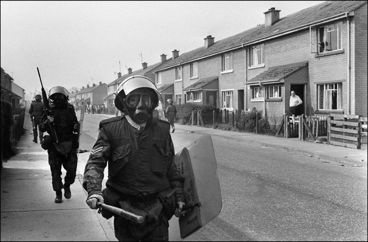 British army soldiers patrol 29 August 1971 in the Bogside quarter of the city of Londonderry during heavy clashes between the Catholic minority, loyal to the Irish Republican Army (IRA), and Protestants. Between 1970 and 1971, the IRA took up arms while Protestant loyalist militias attacked Catholics. Since the partition of Ireland in 1921, the IRA has fought for a complete withdrawal of British troops from Northern Ireland and a reunification of the island of Ireland. Around 3,500 people have died and almost 40,000 have been injured in sectarian violence involving the IRA and pro-British-rule unionist paramilitaries--the so-called loyalists. (Photo credit should read DARDE/AFP/Getty Images)