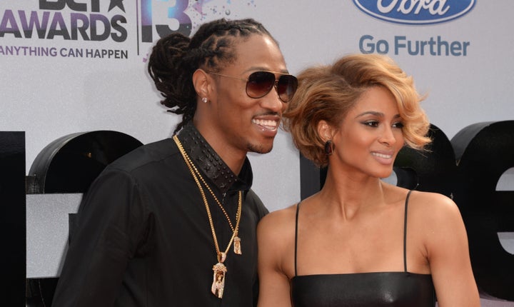 Ciara (R) and Future arrive for the 2013 BET Awards at the Nokia Theatre L.A. Live in Los Angeles, California June 30, 2013. The awards ceremony recognize Americans in music, movies, sports and other fields of entertainment over the past year. AFP PHOTO / ROBYN BECK (Photo credit should read ROBYN BECK/AFP/Getty Images)