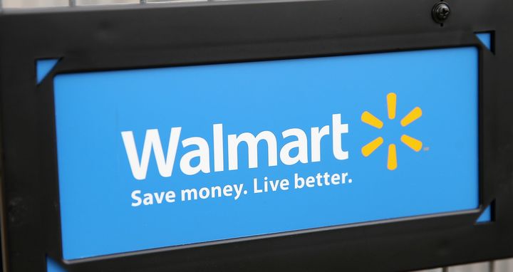 The Walmart logo is displayed on a shopping cart at a Walmart store on August 15, 2013, in Chicago, Illinois. Walmart, the world's largest retailer, reported a surprise decline in second-quarter same-store sales today. The retailer also cut its revenue and profit forecasts for the fiscal year. 