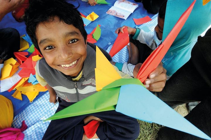 Children play in a tent housing a UNICEF-supported child-friendly space in Tundikhel, a large grass-covered area and important landmark in Kathmanudu, the capital.