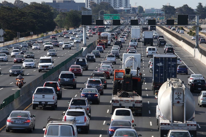 BERKELEY, CA - JULY 01: Traffic makes its way along Interstate 80 on July 1, 2015 in San Francisco, California. AAA is projecting that nearly 42 million Americans will travel 50 miles or more over the Fourth of July weekend, the largest number since 2007. (Photo by Justin Sullivan/Getty Images)