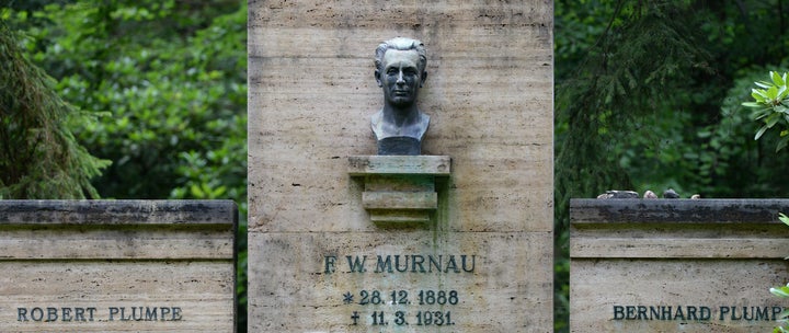 A man looks at a crypt of the Murnau and Plumpe families on July 15, 2015 in Stahnsdorf, Germany. Grave robbers have stolen from a crypt the head of German expressionist cinema great Friedrich Wilhelm Murnau, director of the silent-film vampire classic 'Nosferatu', reports said. AFP PHOTO / DPA / RALF HIRSCHBERGER +++GERMANY OUT (Photo credit should read RALF HIRSCHBERGER/AFP/Getty Images)